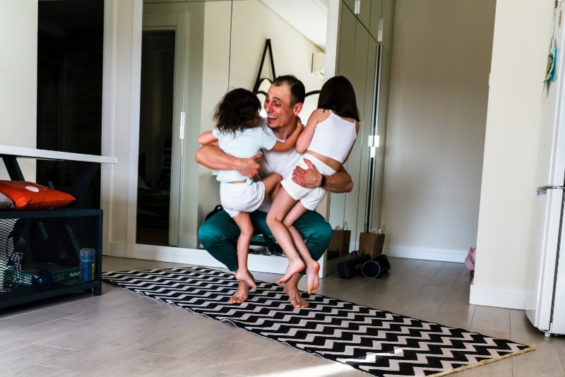 cute small daughters hugs happy daddy.