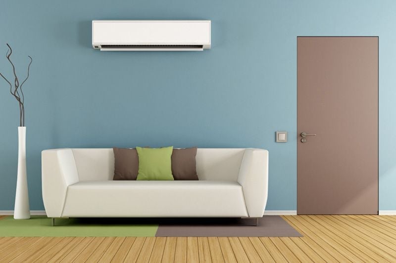 Image of a ductless system above a couch. Planning to Remodel? Go Ductless!.|