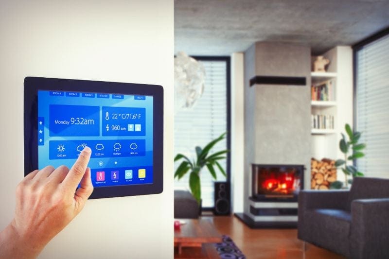 Image of someone pressing on thermostat. Zone Your Way to Comfort.